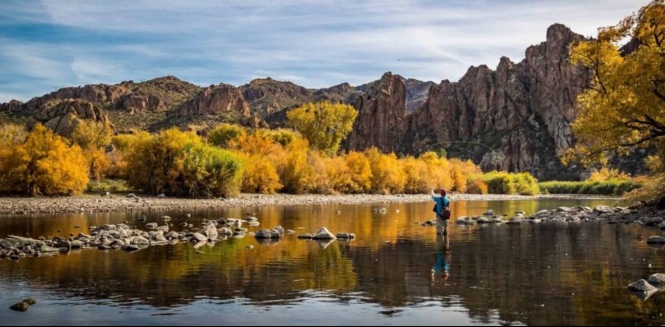 Salt River surrounded by mountains and fall-colored desert shrubs in central Arizona